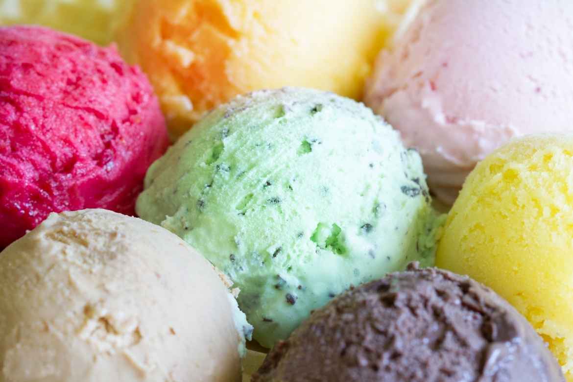 close up shot of scoops of different flavoured ice cream